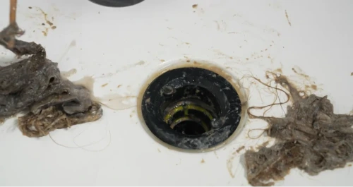 Drain snake removing hair paper and foreign objects from drain