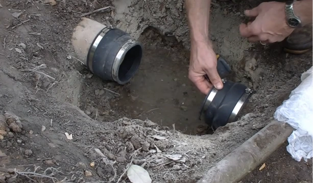 Cracked pipe section being repaired